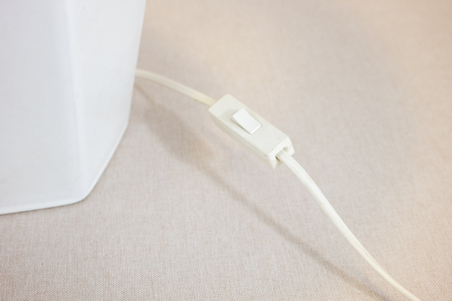 Table lamp with white hexagonal ceramic base and green shade Switch with cord