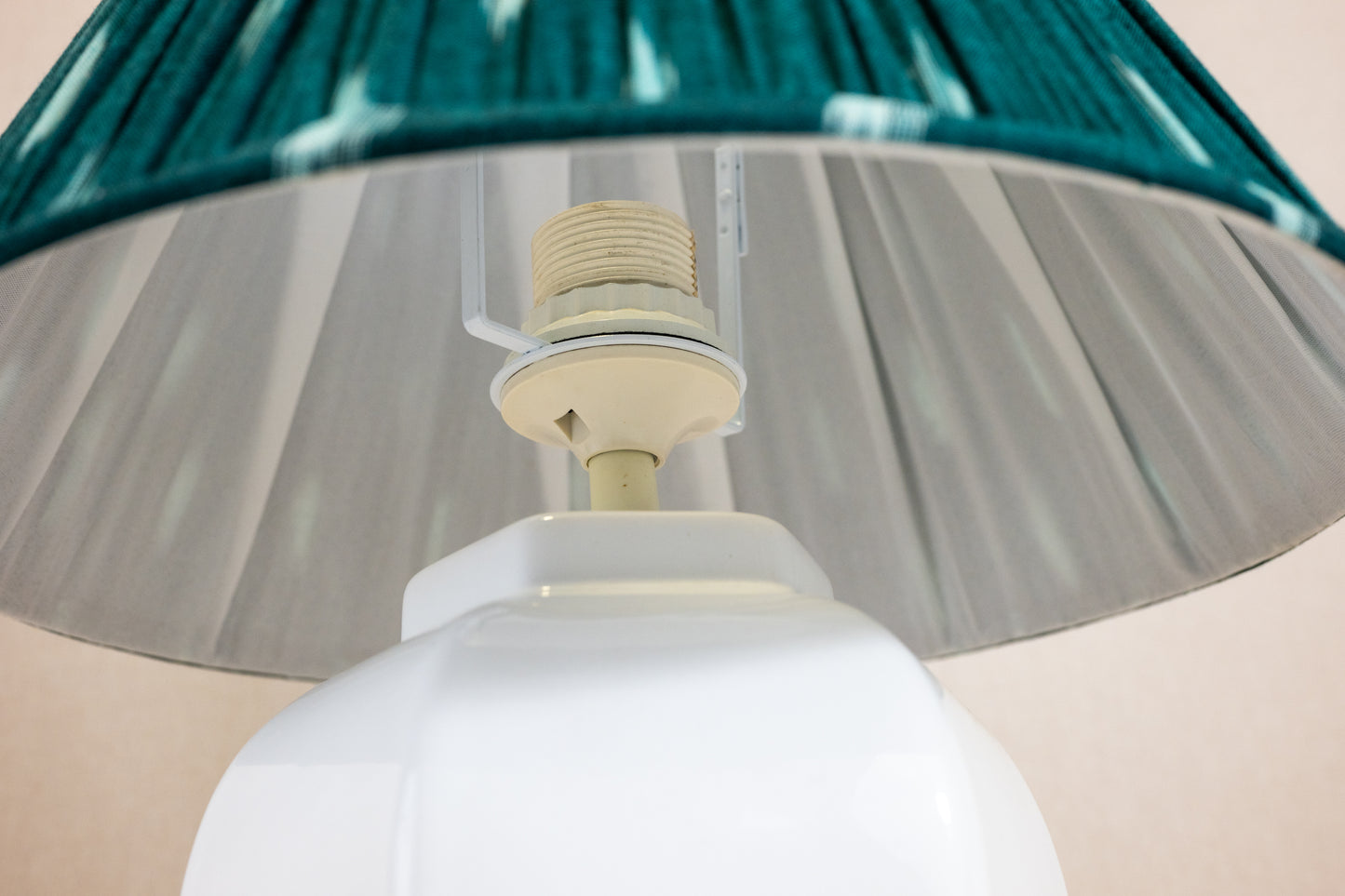 Table lamp with white hexagonal ceramic base and holder for green shade