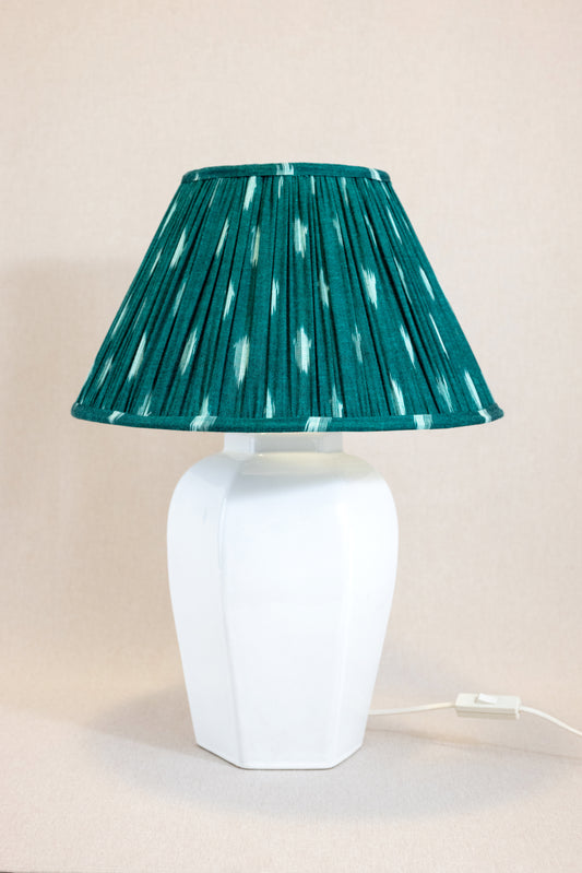 Table lamp with white hexagonal ceramic base with green shade
