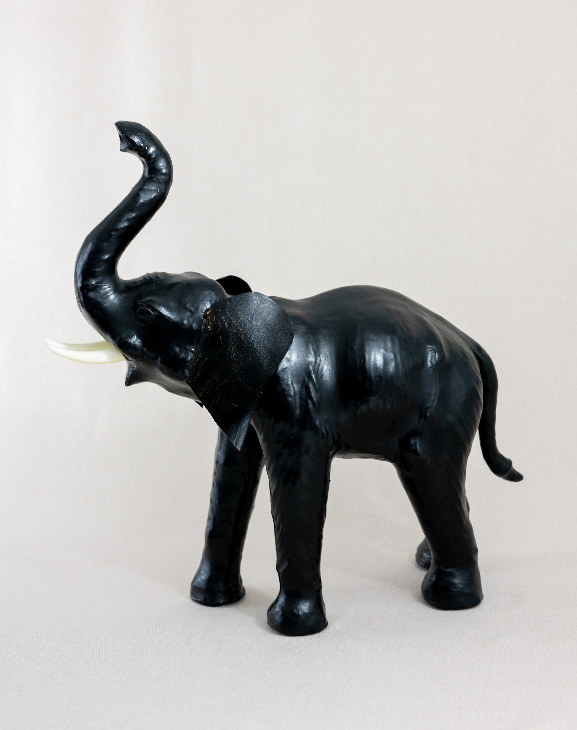 Vintage mid century medium sized Liberty style fireside elephant leather wrapped