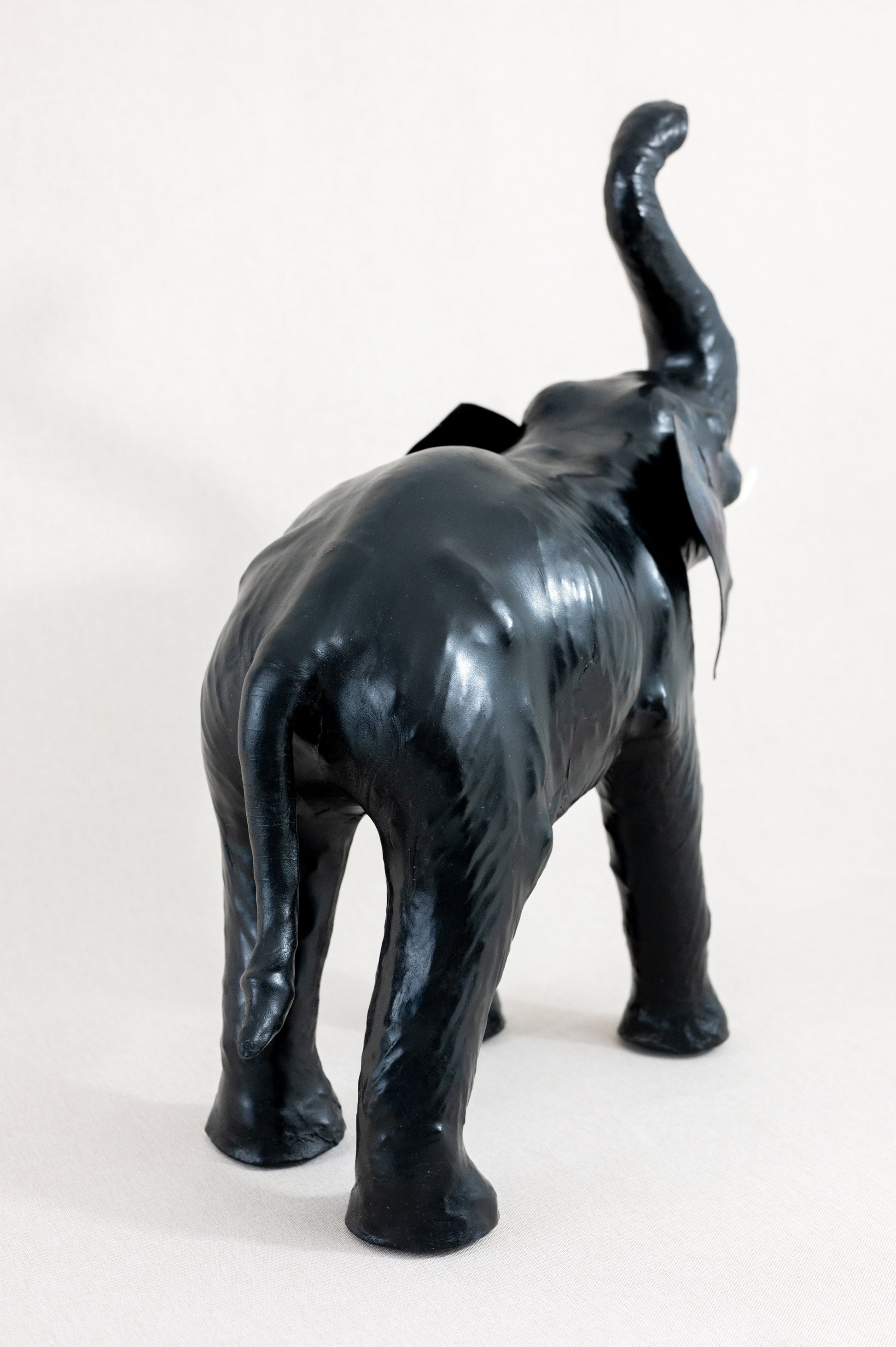 Vintage mid century medium sized leather wrapped Liberty style fireside elephant