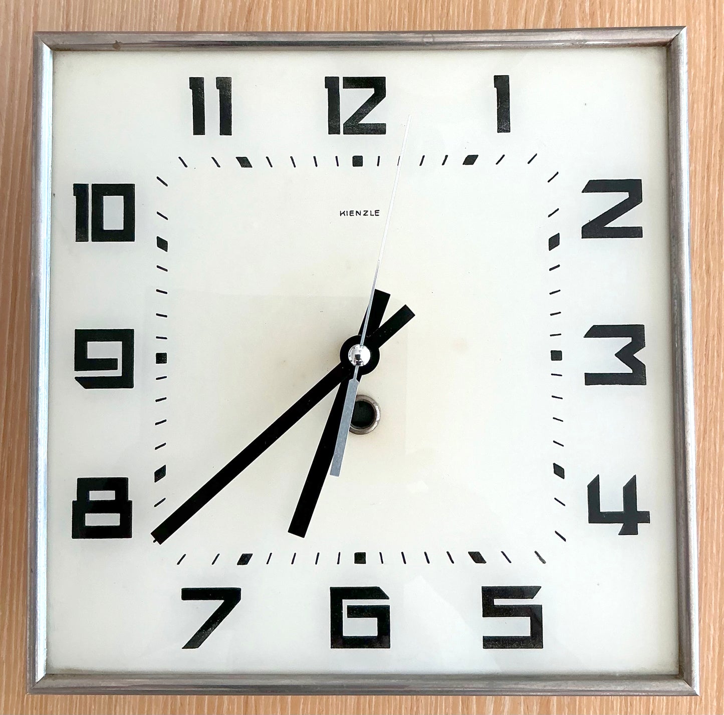 Wall Clock Kienzle Art Deco Bauhaus German Front View on clock on wood
